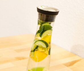 A bottle of water packed with cucumber slices as a weight loss drink.