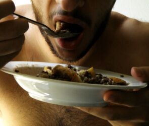 A man eating a bowl of food after a workout.