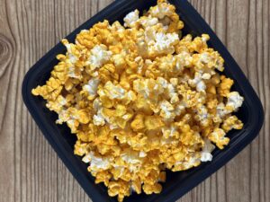 A bowl of popcorn being eaten as part of a healthy weight loss plan