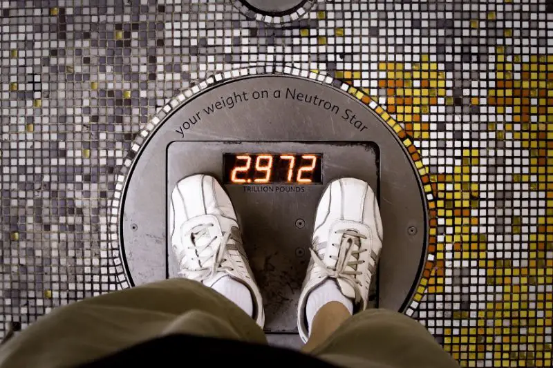 A man on the scales starting a new weight loss routine.
